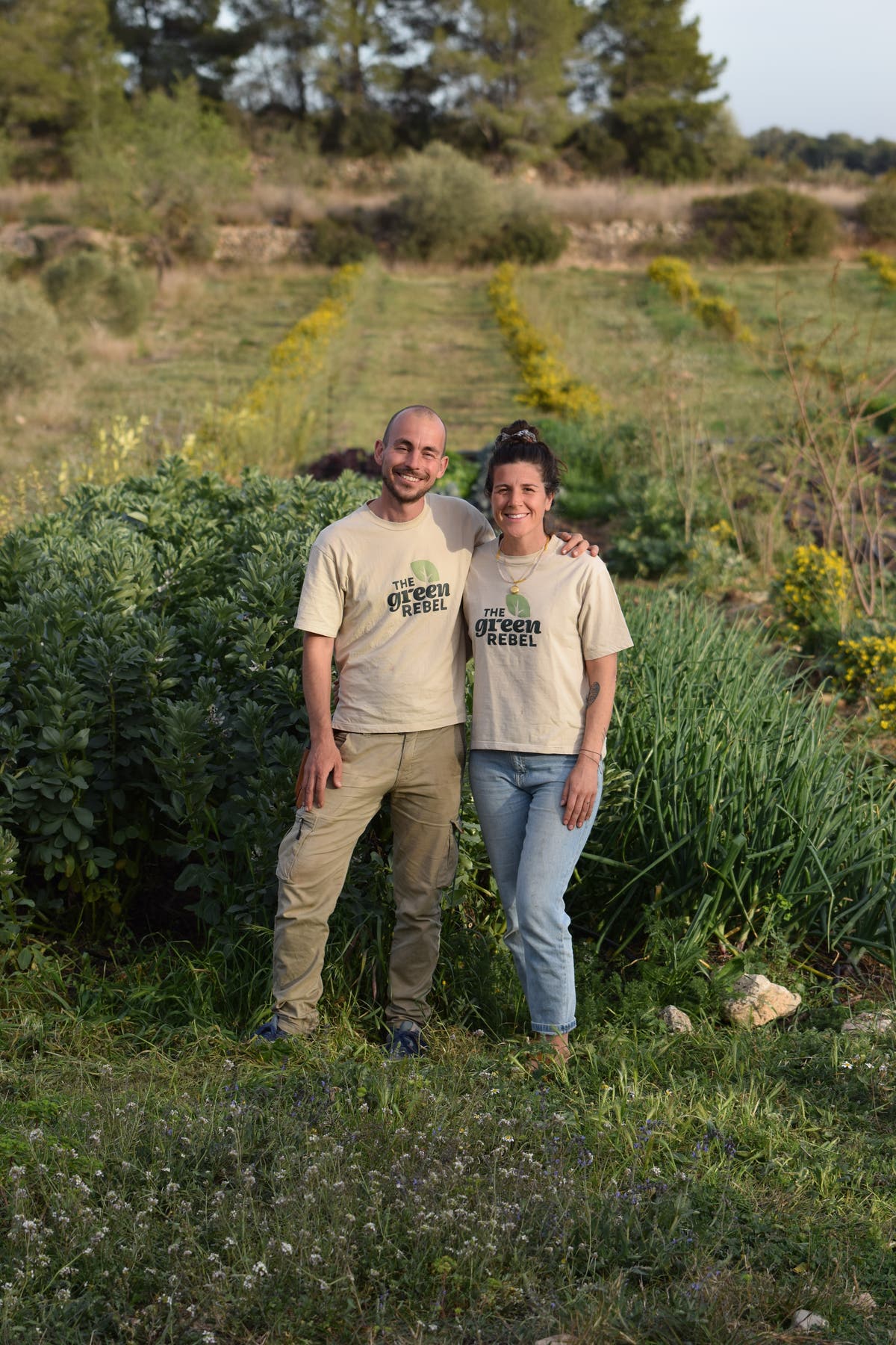 Carlo and Coralie standing on The Green Rebel regenerative farm in Spain